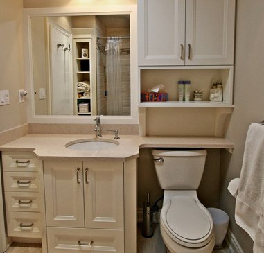 small bathroom with over the toilet storage space for organization